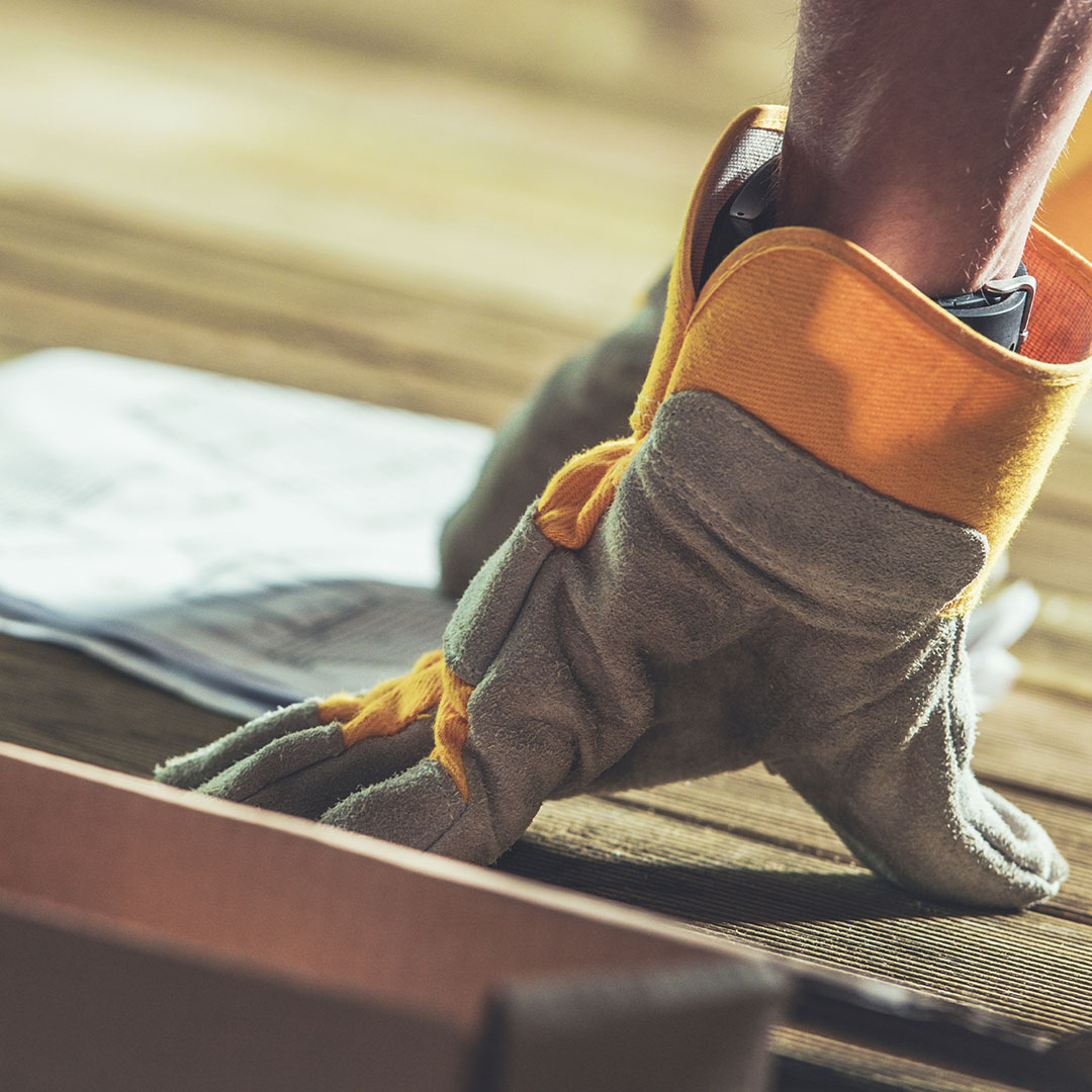 image of a man installing a kitchen fixture