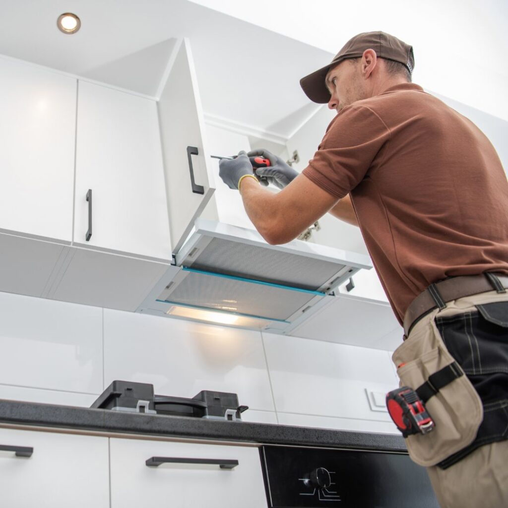 Contractor working on cabinets