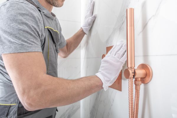 remodeling contractor working on bathroom shower