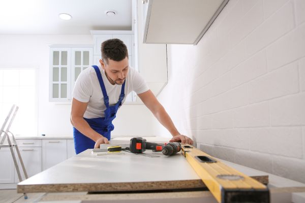 remodeling contractor working on kitchen counters