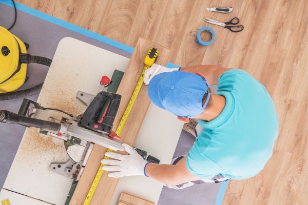 general contractor working on flooring for a remodel