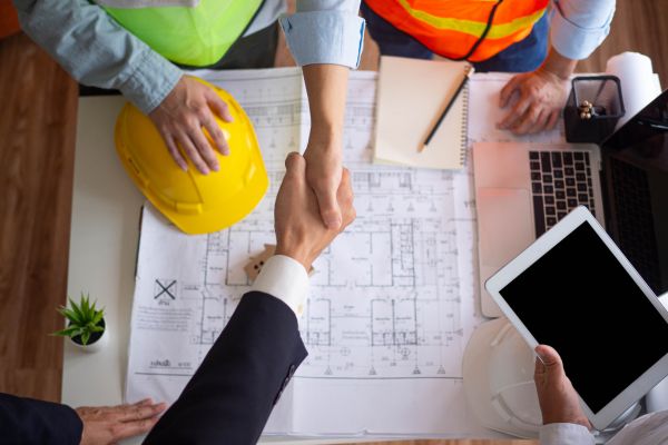 Contractor shaking hands with a client