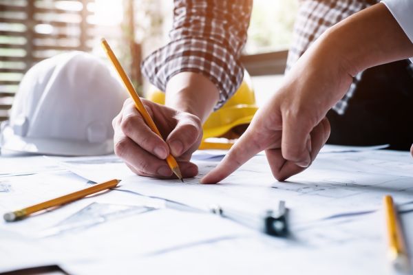 A contractor going over blue prints