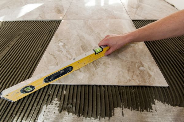 contractor laying tiles