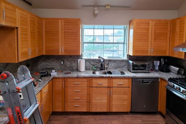 remodeled kitchen with wood cabinets